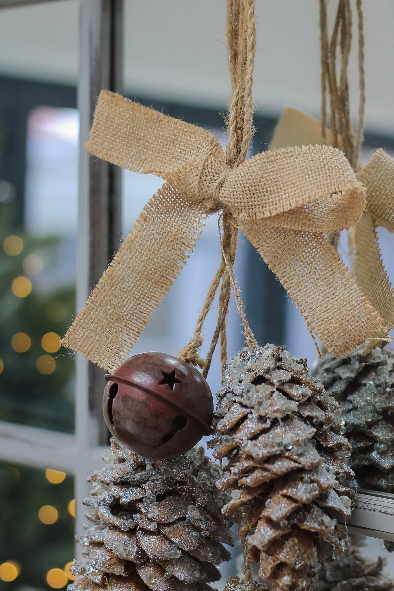 Hanging Pinecones and Rustic Bell with Hessian Bow