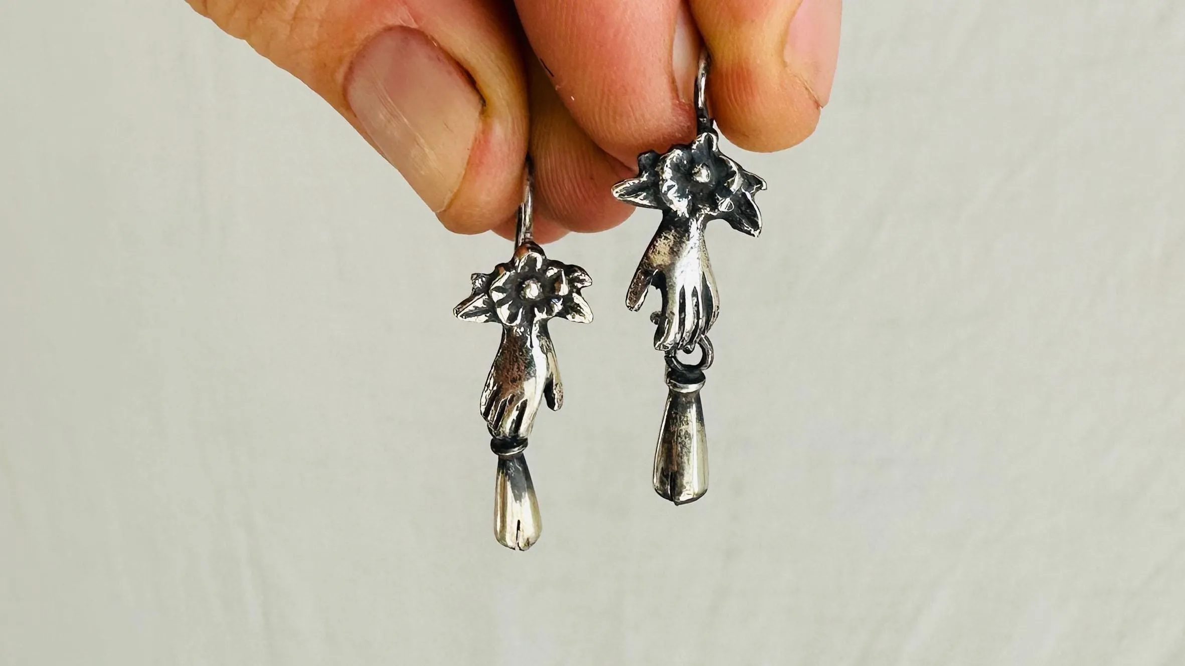 Sterling Silver Earrings. Cast Hand and Monte Alban Bells. 2587